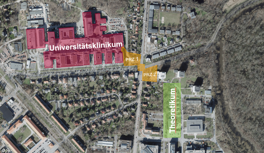 Luftaufnahme des Universitätsklinikums Halle und des angrenzenden Geländes. Das Klinikum ist rot eingefärbt, die künftigen Standorte der beiden Gebäude des PRZ 1 und 2 rechts unterhalb des Klinikums sind gelb markiert.